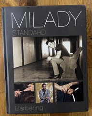 Milady Standard Barbering Hardcover Textbook. Used Good Condition.
